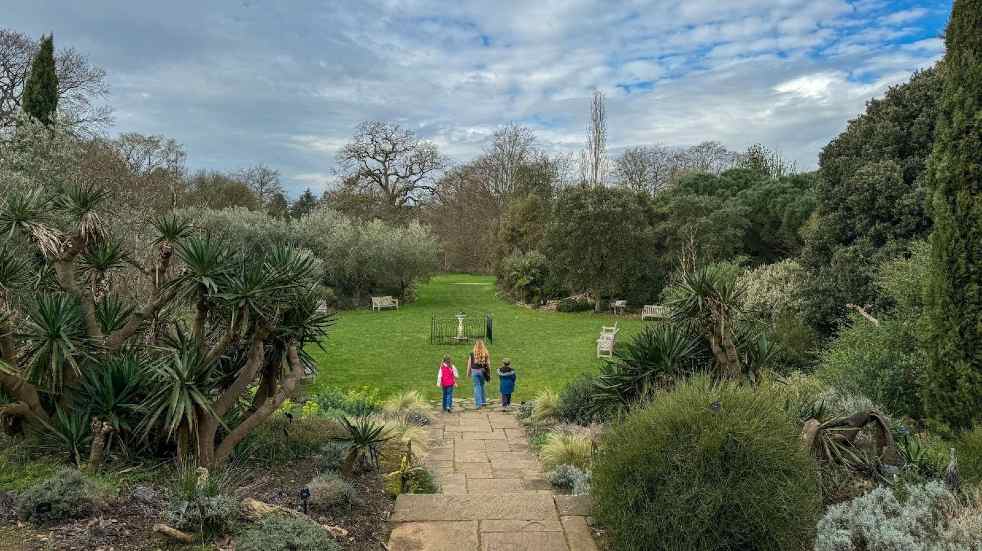 Mother and two children walking at Kew Gardens